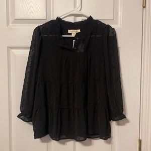 black polka dotted blouse